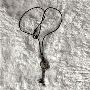 UNO DE  50 Silver key necklace with brown leather